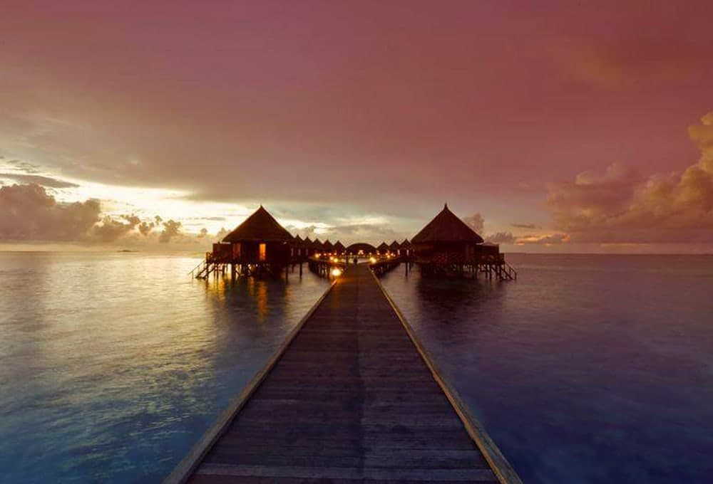 sunset on water villas Maldives holiday
